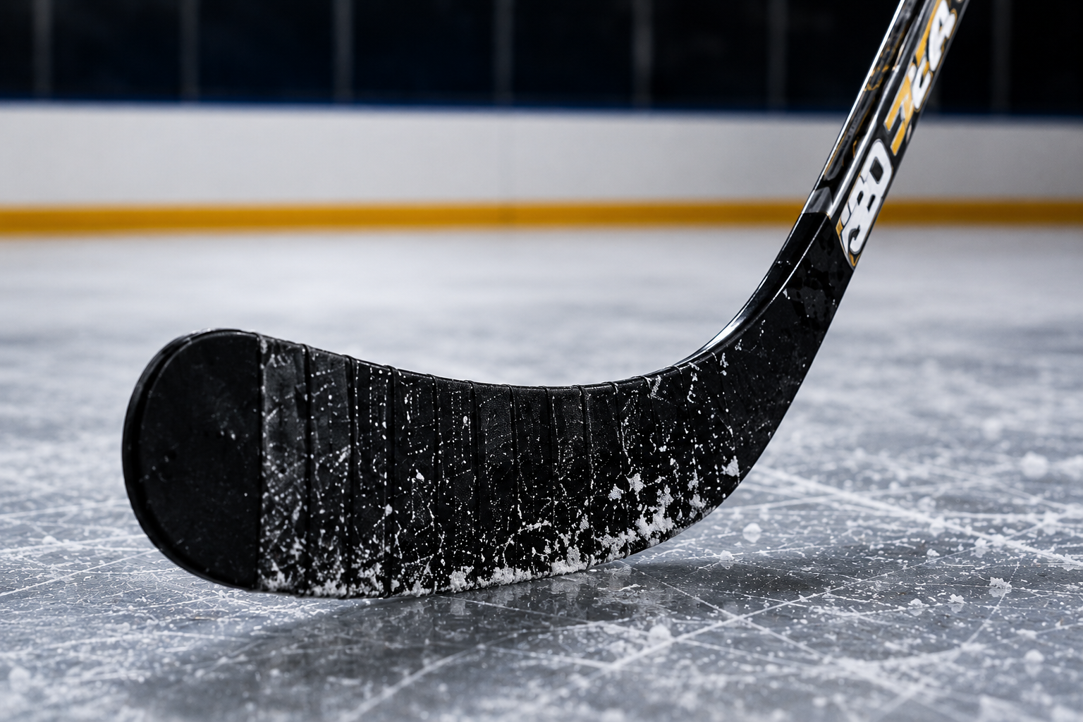 Close-up hockey stick blade on ice